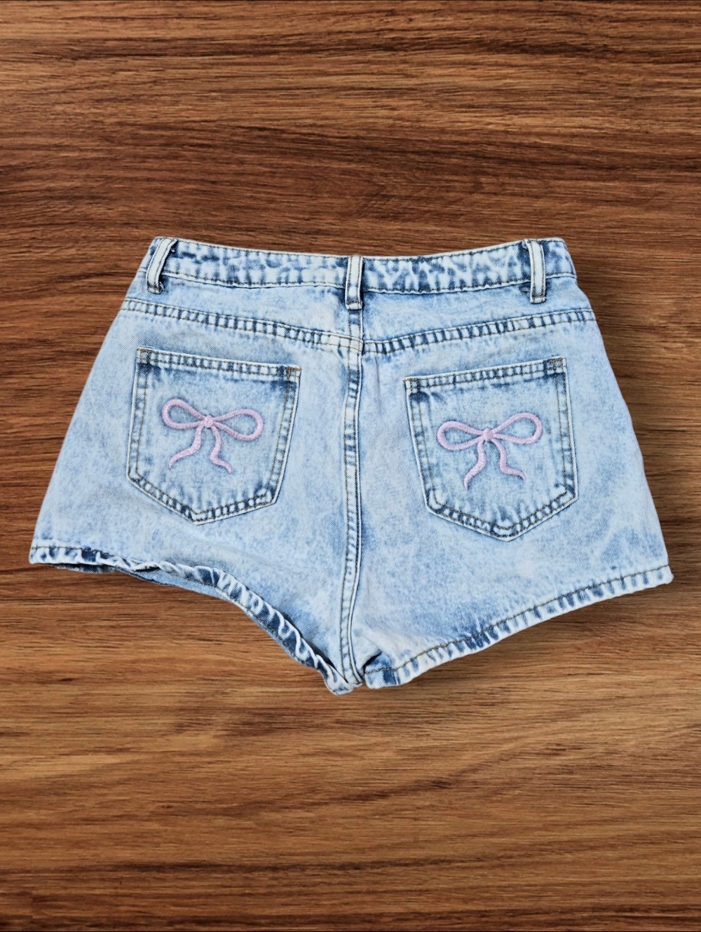 SHEIN Light Wash Denim Short Shorts with Pink Bow Stitching